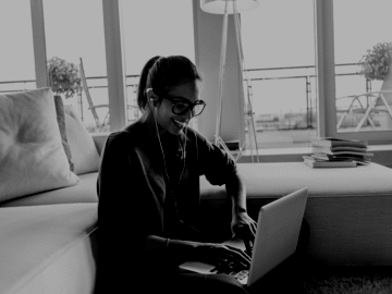 Woman writing on her laptop